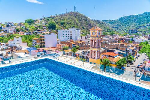 a large building with lots of windows on top of it at Tres Marias Luxury Suites - Adults Only in Puerto Vallarta