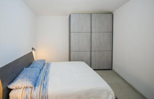 Кровать или кровати в номере Tatta & Nanna Apartment
