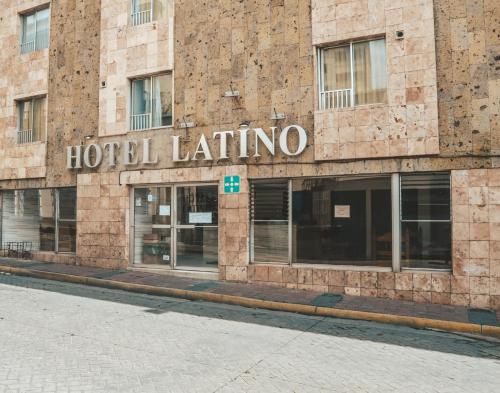 a hotel latino sign on the side of a building at Hotel Latino in Guadalajara