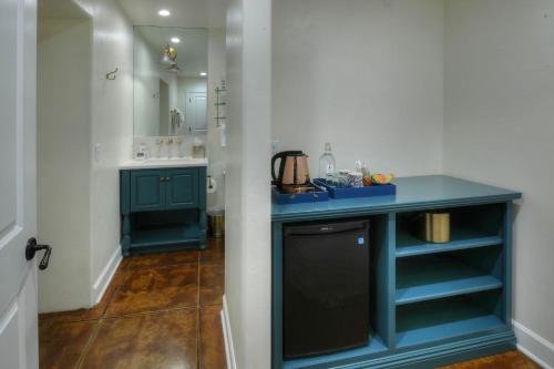 a bathroom with a blue counter and a sink at Armory Park Inn in Tucson
