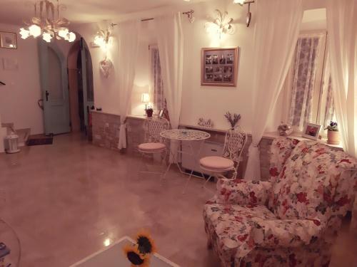 a living room with a couch and a table at Villa Claudia in Fažana