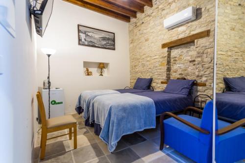 Postel nebo postele na pokoji v ubytování Lazaros Stonehouse
