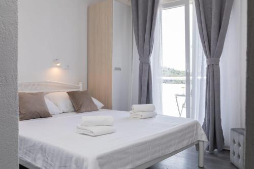 Postel nebo postele na pokoji v ubytování MALOA One bedroom White