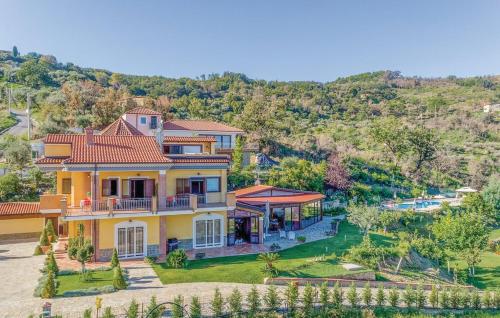 an aerial view of a large yellow house at Casa Vacanza Villa Aurora in Laureana Cilento