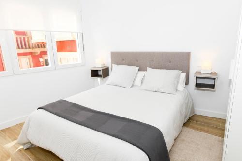 A bed or beds in a room at Dúplex Costa de Fisterra I