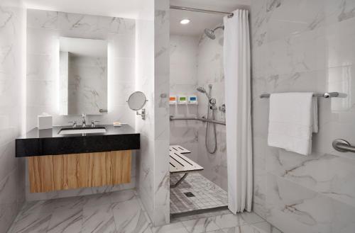a bathroom with a sink and a shower at The LINQ Hotel and Casino in Las Vegas