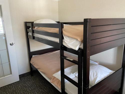 a couple of bunk beds in a room at Best Western Cedar Park Inn in Edmonton