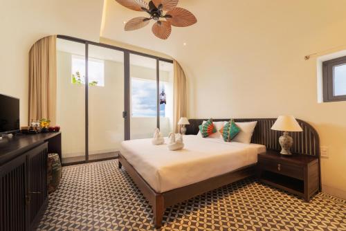 Ένα ή περισσότερα κρεβάτια σε δωμάτιο στο Hoianoi Villa