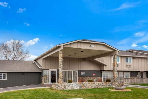 a large house with a garage at La Quinta Inn by Wyndham Caldwell in Caldwell