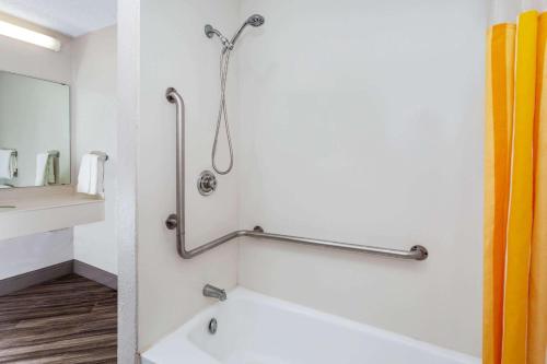 a bathroom with a bath tub and a shower at La Quinta Inn by Wyndham Laredo I-35 in Laredo