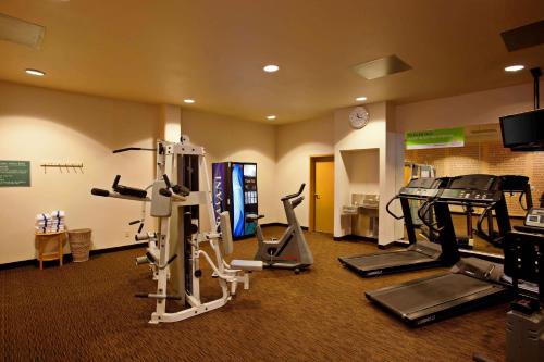 a gym with cardio equipment in a hotel room at La Quinta Inn & Suites by Wyndham Irvine Spectrum in Irvine