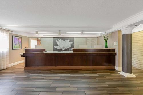 a lobby with a waiting room with a reception desk at La Quinta Inn by Wyndham Miami Airport North in Miami