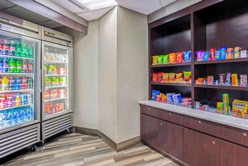 a grocery store aisle with a refrigerator and drinks at La Quinta by Wyndham Birmingham Homewood in Birmingham
