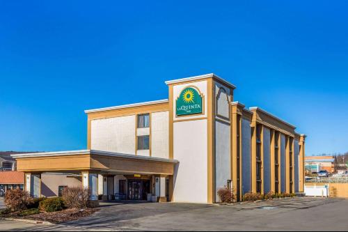 a building with a sign on the front of it at La Quinta Inn by Wyndham Binghamton - Johnson City in Johnson City