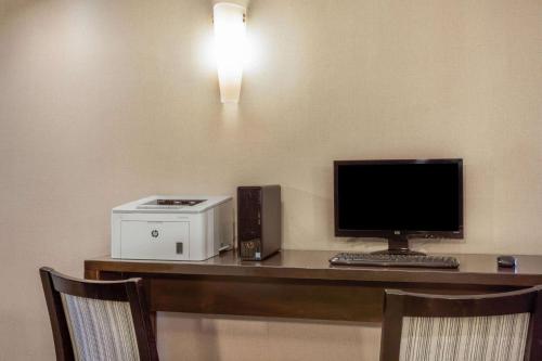 a desk with a computer and a printer on it at La Quinta Inn by Wyndham Binghamton - Johnson City in Johnson City