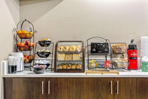 a buffet with different types of food on a counter at La Quinta by Wyndham Biloxi in Biloxi