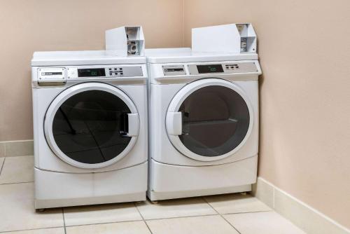 two washing machines sitting next to each other in a room at La Quinta by Wyndham Bozeman in Bozeman