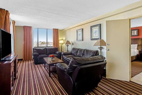 a living room with a couch and a television at La Quinta by Wyndham Salisbury in Salisbury