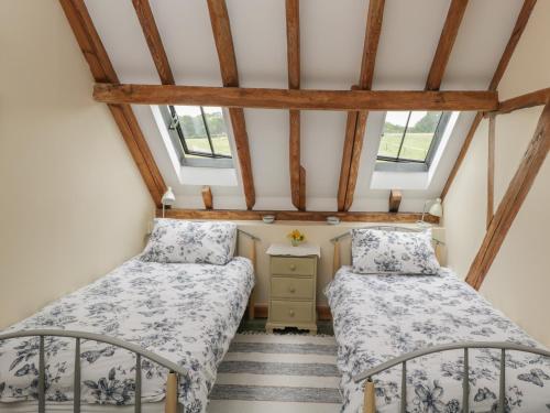 Voodi või voodid majutusasutuse Breaches Barn toas