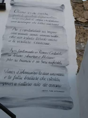 a white sheet of paper with writing on it at B&b barbaricino iun F1442 in Oliena