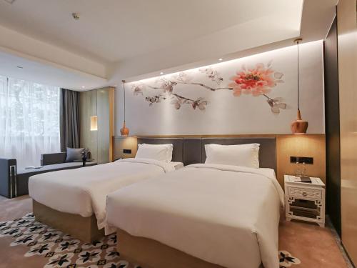 Postelja oz. postelje v sobi nastanitve Paco Hotel Beijing Road Metro Guangzhou