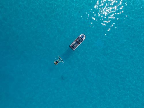 an aerial view of a boat in the water at Villa Nautica Paradise Island Resort in North Male Atoll