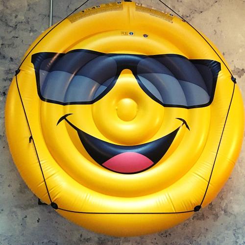 a yellow smiley face ball with sunglasses on it at The Originals City Hotel Artyster Clermont Ferrand in Clermont-Ferrand