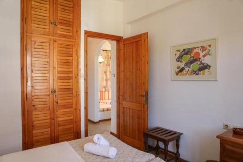 Postel nebo postele na pokoji v ubytování Pandora Studios Skiathos
