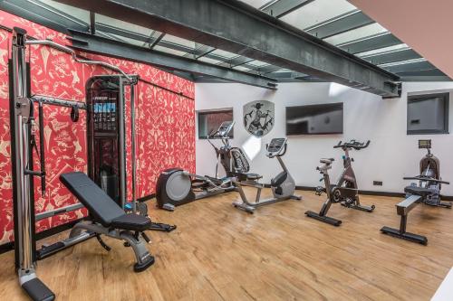 a gym with treadmills and cardio equipment in a room at Pointe Isabelle in Chamonix