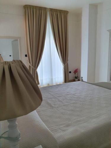 Ein Bett oder Betten in einem Zimmer der Unterkunft L'attico b&b