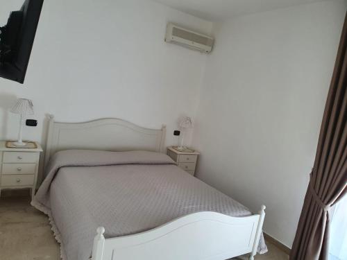 Ein Bett oder Betten in einem Zimmer der Unterkunft L'attico b&b