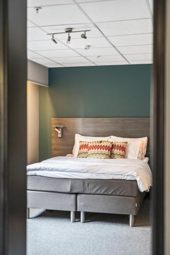 Ένα ή περισσότερα κρεβάτια σε δωμάτιο στο Easy Stay Haugesund