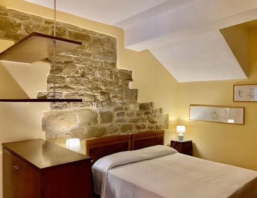 Ένα ή περισσότερα κρεβάτια σε δωμάτιο στο Agriturismo KeBio I Tenuta di Fassia