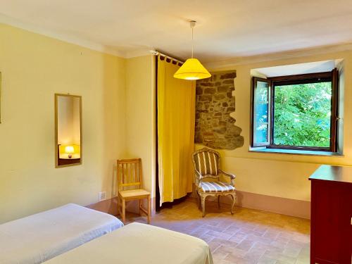 Ένα ή περισσότερα κρεβάτια σε δωμάτιο στο Agriturismo KeBio I Tenuta di Fassia