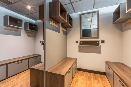 a kitchen with wooden counters and cabinets and a window at Pointe Isabelle in Chamonix-Mont-Blanc