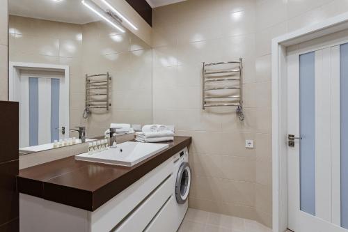 Ванна кімната в Prestige Plaza Apartments