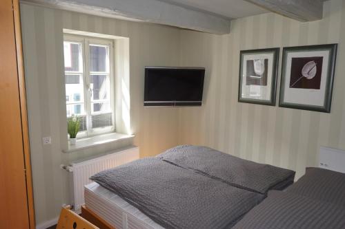 Ένα ή περισσότερα κρεβάτια σε δωμάτιο στο Altstadtperle Wernigerode