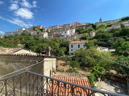 a view of a city from the balcony of a building at Fisolare Suite romantica per due in Capestrano