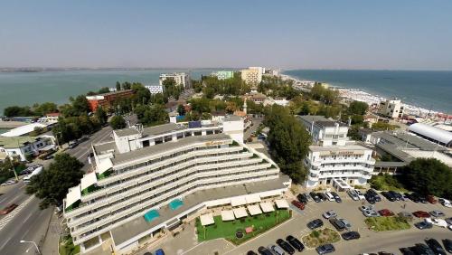 an aerial view of a large building with a parking lot at Hotel Condor in Mamaia