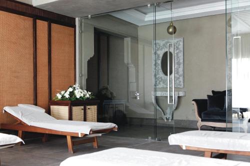 a room with two beds and a mirror at Hotel Riu Tikida Dunas - All inclusive in Agadir