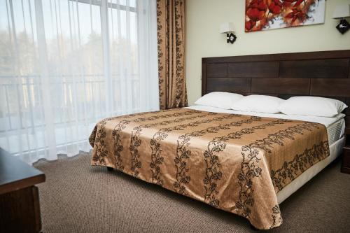 Een bed of bedden in een kamer bij Sanatoriy Serebryany Ples