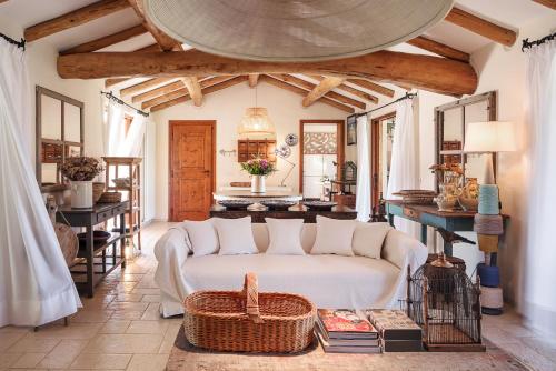 a living room with a couch and a table at Albero Capovolto in Golfo Aranci