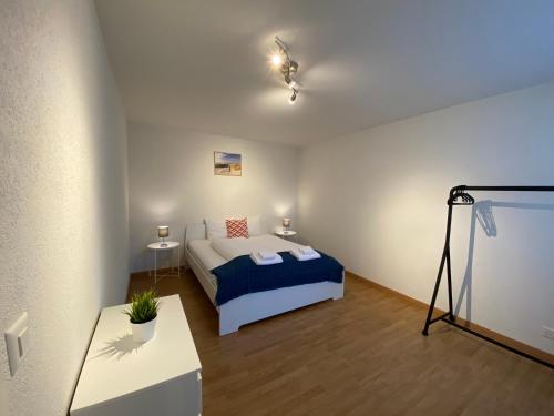a bedroom with a bed and a table in a room at Galaxy Apartments Lucerne in Luzern