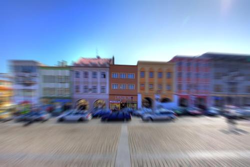 a blurry picture of a city with cars in the street at Penzion Menšík in Kroměříž