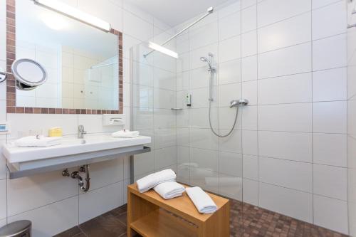 
Ein Badezimmer in der Unterkunft Hotel Almrausch
