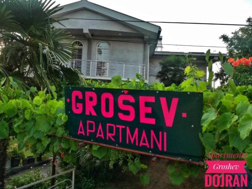 a sign that reads greasyarmaarma in front of a house at Apartments Groshev in Star Dojran