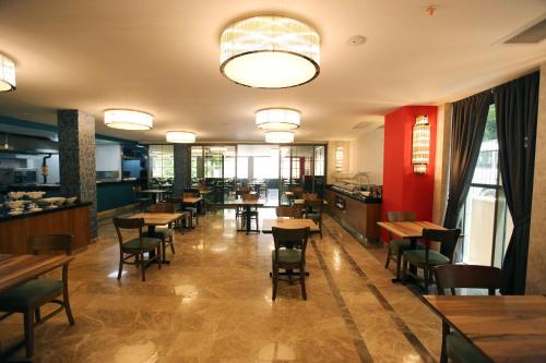 a restaurant with tables and chairs in it at Best Western Plus Center Hotel in Ankara