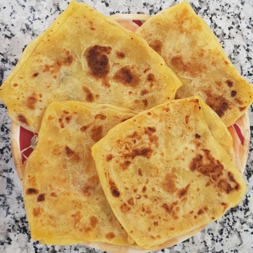 a pile of tortilla chips in a bowl on a table at Dar Assarou - Toubkal National Park Lodge in Imlil