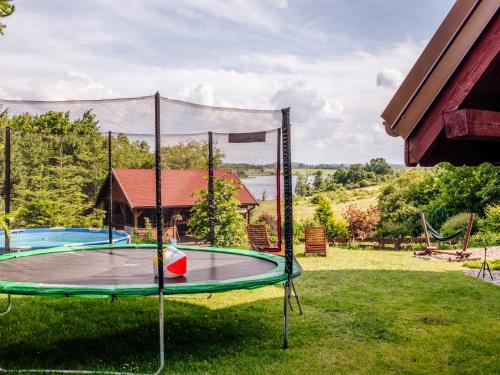a trampoline in the yard of a house at Gospodarstwo Agroturystyczne Rowerowa Przystań "Jankesówka" in Lidzbark Warmiński