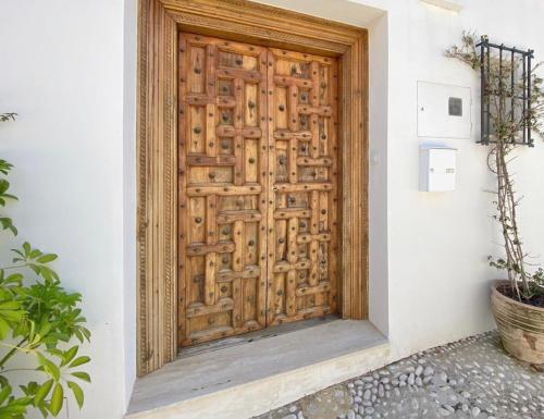 a wooden door on the side of a building at Casa Celeste in Alicante
